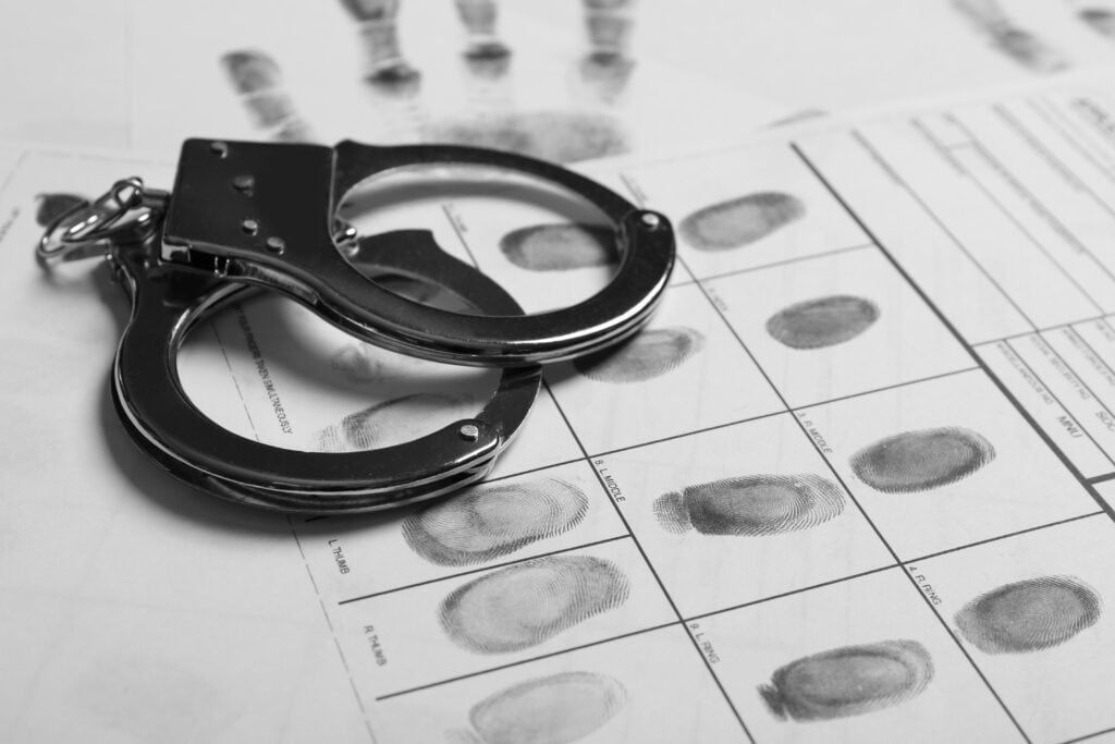 Police-handcuffs-and-criminal-fingerprints-card-1024x683.jpg