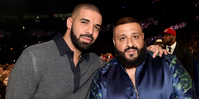 Drake and DJ Khaled pose for a snap at awards ceremony